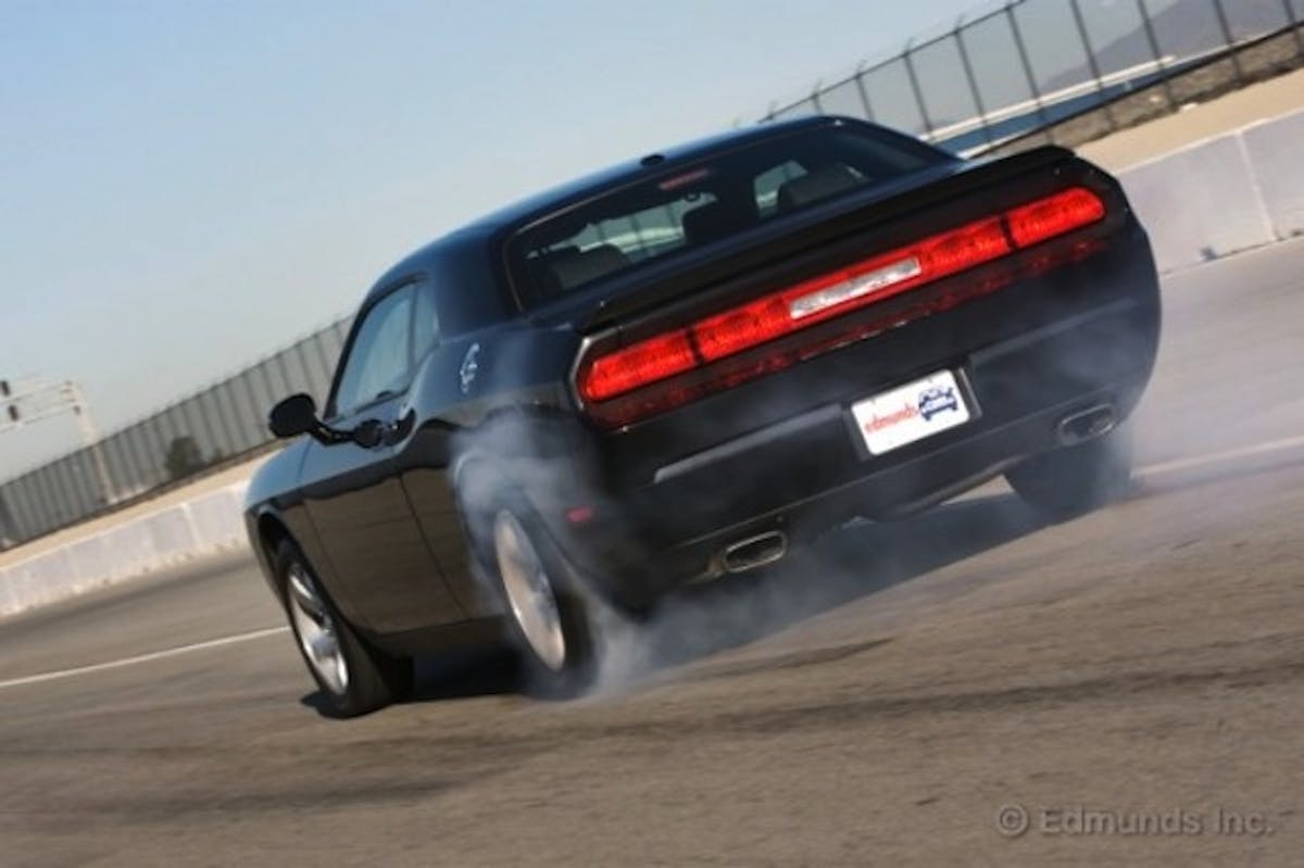 Burnout-Super-Test-Camaro-SS-vs.-Mustang-GT-vs.-Challenger-RT-rear-angle-view-575x383