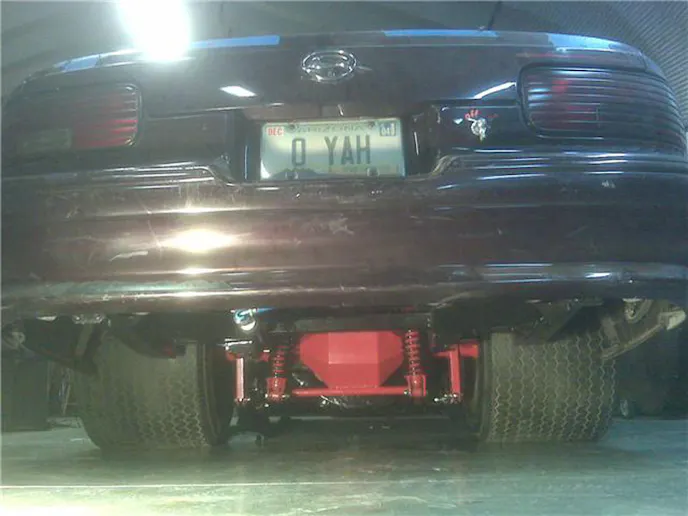 Red Rear End Under Car