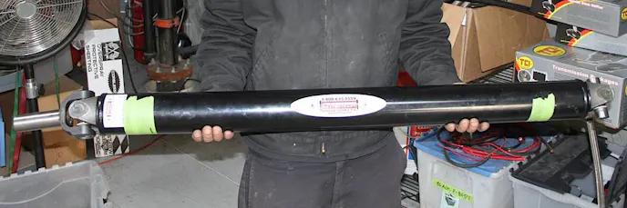 The driveshaft in our Project BlownZ 275 Radial Camaro: a 100% chromoly steel shaft measuring 45-inches (u-joint to u-joint), with a 3.5-inch diameter. The shaft features a Spicer 1350 Series U-joint, with a 6-inch Dana Forged Steel yoke. Dynotech custom-built this driveshaft to match our combination and handle upwards of 2,000 horsepower.