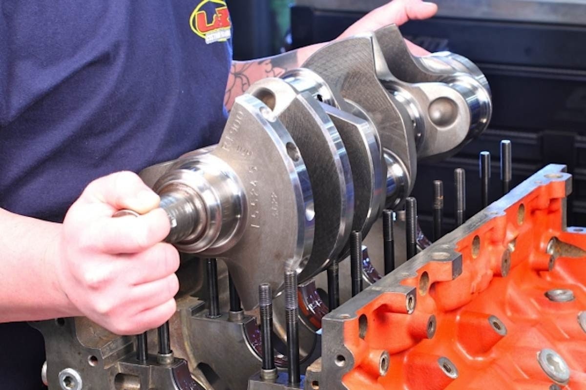 The Lunati Pro Series crank was mic’d and the measurements compared to dial-bore readings of the mains to ensure a .0028-inch clearance. After the crankshaft was positioned in the block, the mains were lubricated and torqued down: 60 ft-lbs on the inside bolts, 50 ft-lbs on the outside and 25 ft-lbs on the side bolts.