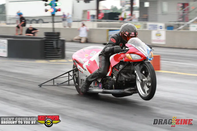 Terry Schweigert put up a 4.09 today, the quickest Pro Extreme bike so far in today’s test session. The Suzuki GS bike runs an 1800 cc engine. Schweigert owns Road End Farms, a dairy farm on the US/Canada border in British Colombia, his bike is painted to make with Canada colors on one side and US on the other. Sponsors include Robinson Industries, Vance and Hines, Lectron, Schnitz Racing, Datona Sensors, Vortex Racing Heads and Speedtech nitrous.