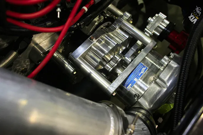 The new Chassisworks CDS gear drive unit that drives our new ProCharger F1-X supercharger. With the new blower, we're anticipating making in the area of 1,650 horsepower at the tires. This gear drive also incorporates a belt-drive for our new Aeromotive Hex Drive fuel pump, meaning we can run the pump right off the crankshaft and eliminate power draw from the battery.