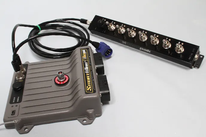 The box itself is not large at all - measuring only 6.5-inch long, 5.5-inch wide, and 2.0-inch high, and weighs under two pounds. We paired it with a SwitchPanel from Racepak for ease of use.