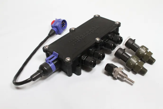 One of Racepak's USM 4 Sensor Input Modules allows us to tie in a number of sensors directly to the module, and to the Racepak via one V-Net cable.