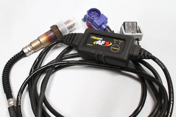 We added one of Racepak's AF-1 single-channel wideband air/fuel sensor kits to our build. It comes with a high-quality Bosch sensor and ties right with with the rest of our system through the V-Net.