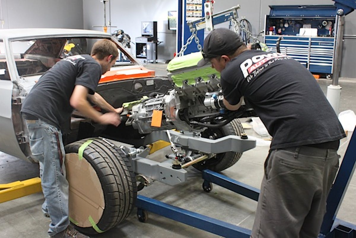 With the clutch installed, the TREMEC transmission was bolted to the engine and the entire assembly was guided into the Camaro’s custom Chassisworks front subframe. At this point, none of the floorpan modifications were made; we needed to get an idea where the position of the shifter was before cutting into the metal floor.