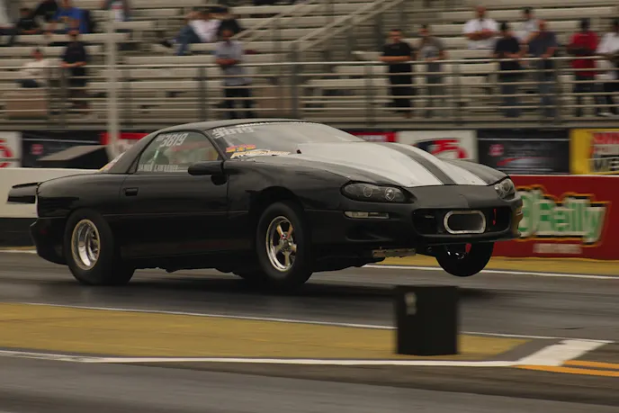 In a Sign of the End Times, Power Automedia (the company behind fine web titles like Dragzine.com) founder James Lawrence found a seven-second pass and got the world's quickest magazine project car into second