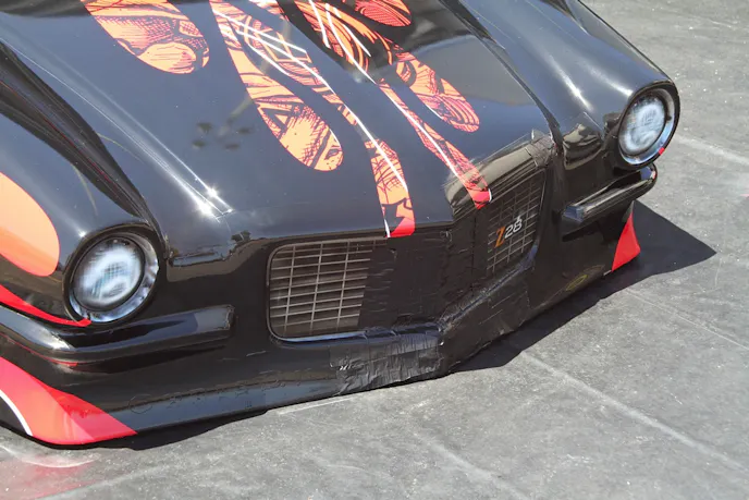 Scott Oksas' close encounter with the reflector blocks in yesterday's qualifying did leave a mark; though the blocks are made from foam, hitting ANYTHING at 200 MPH is going to be messy. Racer tape to the rescue!