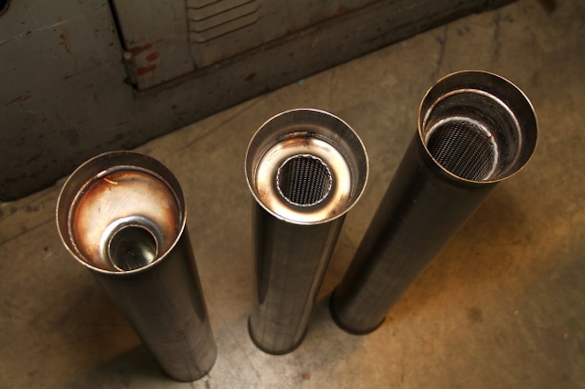 The three muffler options - from left, the reverse-flow muffler, the standard glasspack, and the high-flow glasspack.