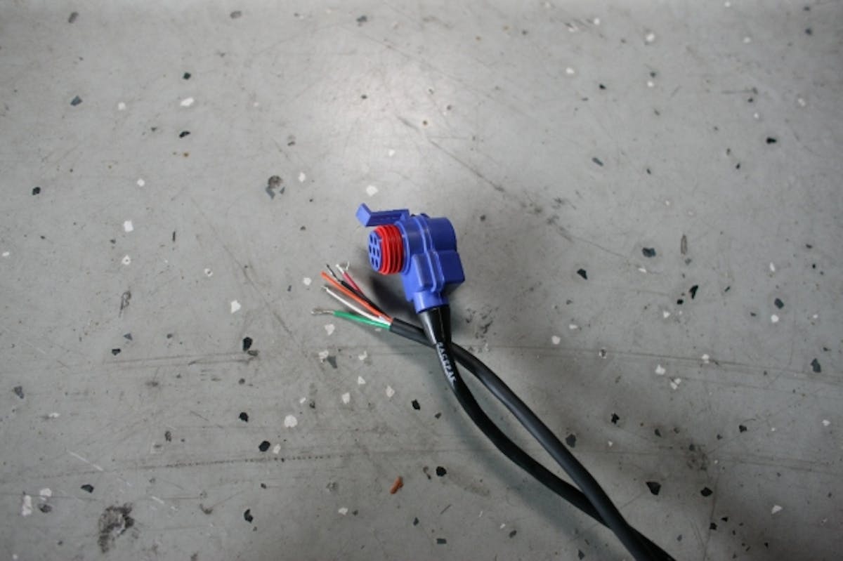 Racepak's V-Net technology  transmits a signal through these cables, which tie into the system to aid in datalogging.