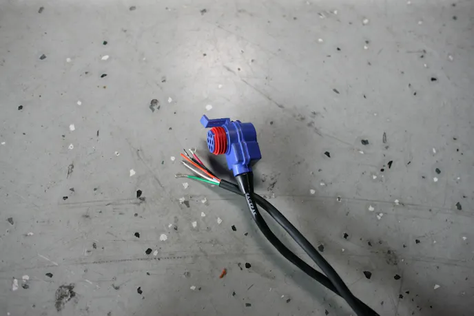 Racepak's V-Net technology transmits a signal through these cables, which tie into the system to aid in datalogging.