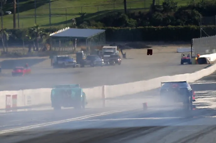 In the second round of qualifying, Scott Oksas got a bit loose on the top end and sent a few reflector blocks flying, but managed to reel it back in and avoid anything more dangerous than foam.