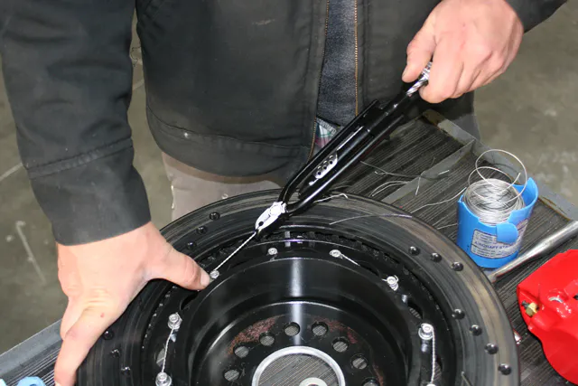 We found that the rear rotor and hat assembly bolts had to be safety wired for this kit because they have no backing nuts. The bolt heads are pre-drilled for this.