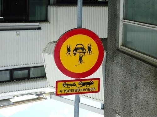 The sign, now properly oriented, clearly showed a car driving into pedestrians at the local farmer's market.