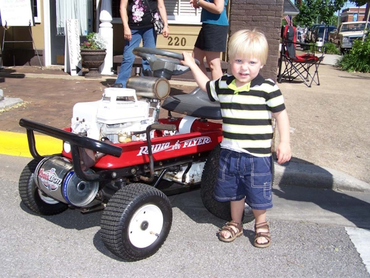 A Briggs & Stratton-powered wagon caught this youngster's attention.
