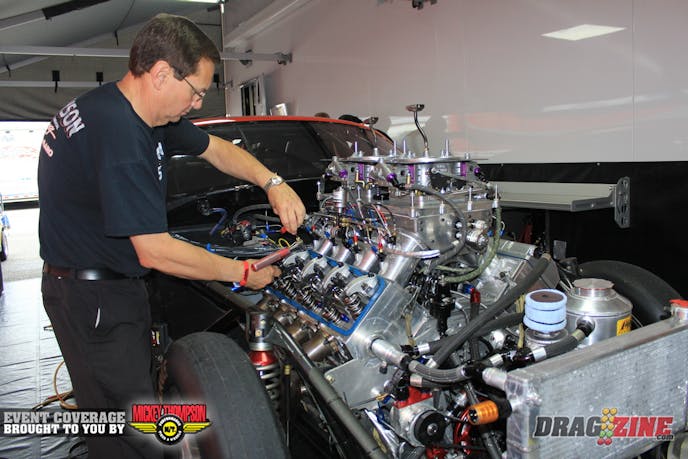Pro Mod racer Dan Stevenson is running this weekend, when I stopped by this morning Charles Carpenter was going over the valves on the Reher Morrison 872 which is fed by a Switzer Dynamics nitrous system.
