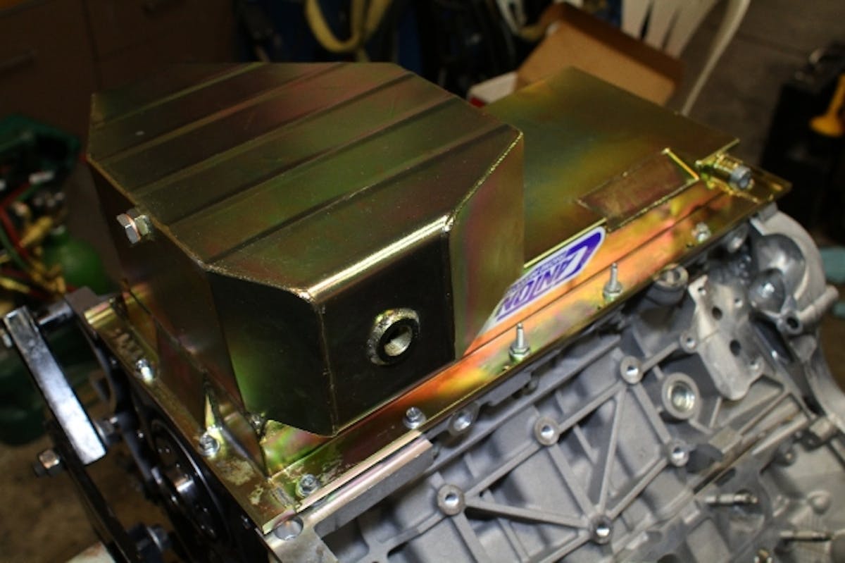 Our Canton Racing Products road-race style oilpan had a couple of additional ports added in - give them a call if you need a beautiful TIG-welded, trap-door-equipped pan - or even a stock replacement.