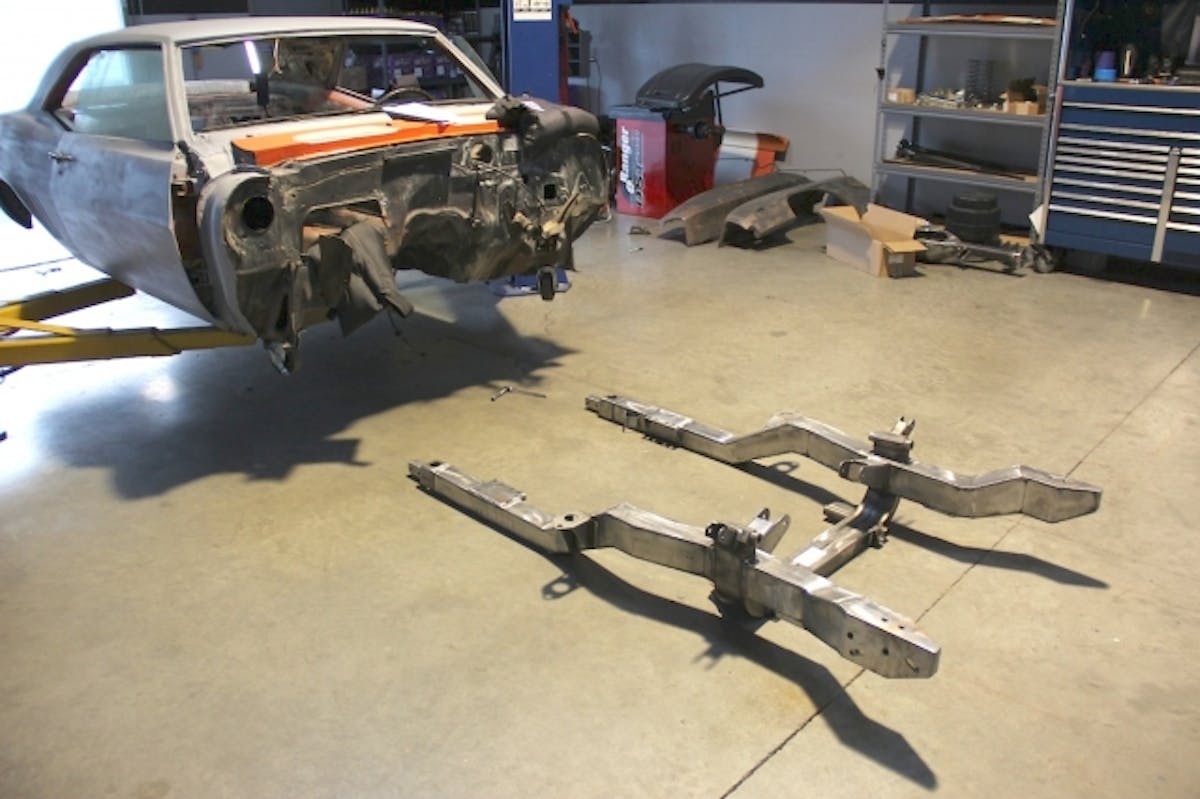 Our new engine had not arrived but we were eager to get the new subframe mounted. So we put the frame in position and bolted it to the chassis.