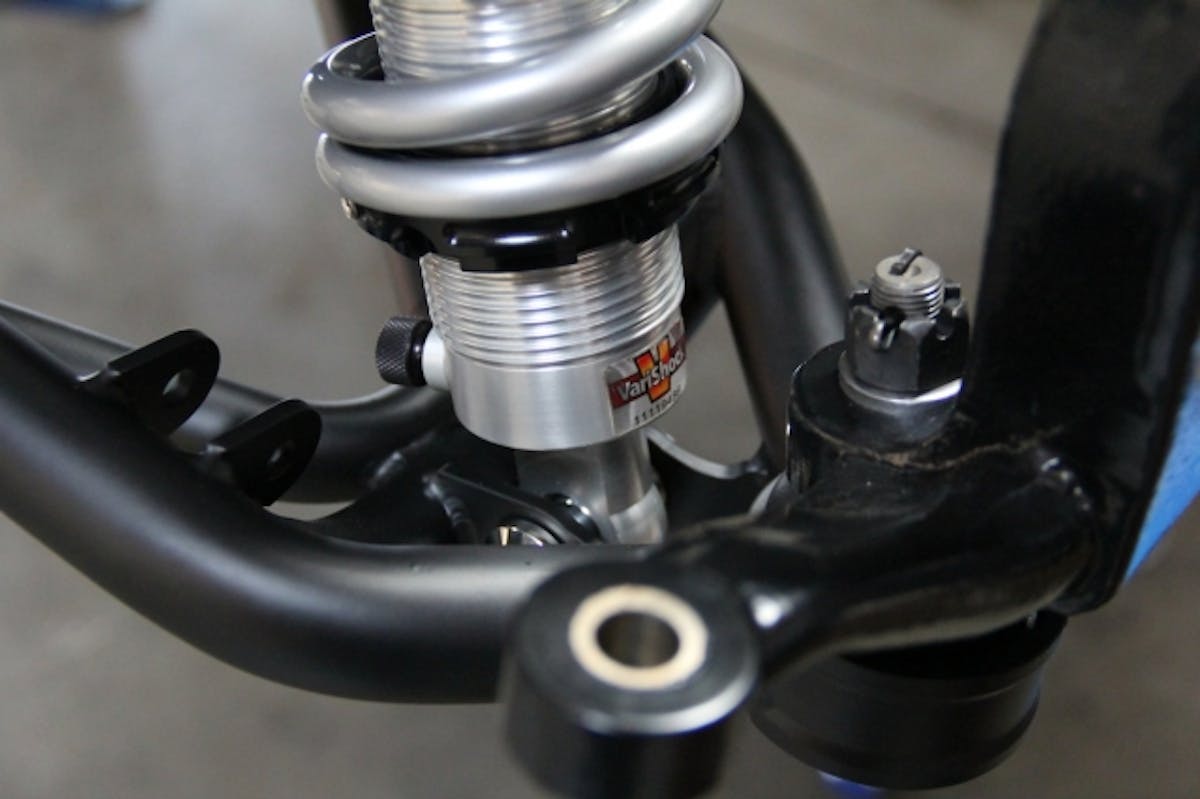 Lower shock mount is located very close to the balljoint, increasing the shock-motion ratio and allowing use of lighter, lower-rate springs for better suspension control.