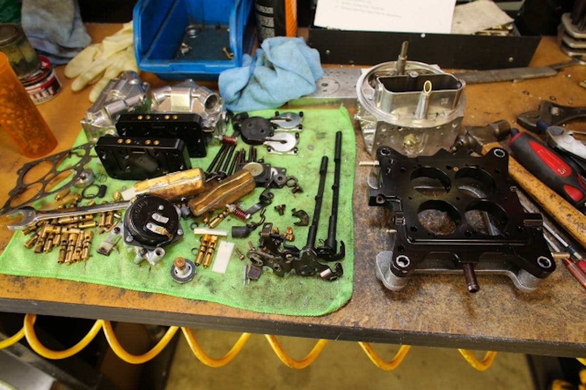 Once disassembled, all parts are laid out on the table. Some of them will be reused, some will be modifed to CSU's specs, and some will be discarded.