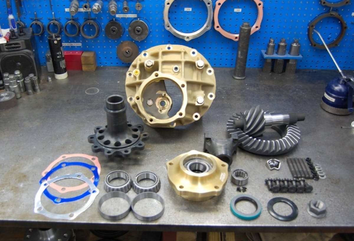 The components of a Mark Williams center section, including the case itself, the spool and ring gear, pinion and pinion support, and bearings.