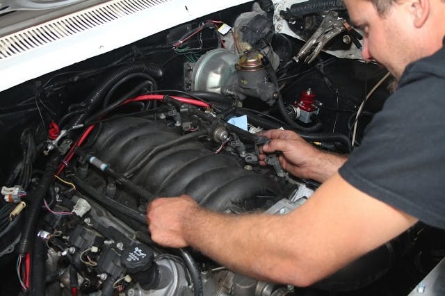 Removal of the factory parts was first order of business - the fuel rails and harness needed to come out of the car before we could begin to install MSD's goodies.