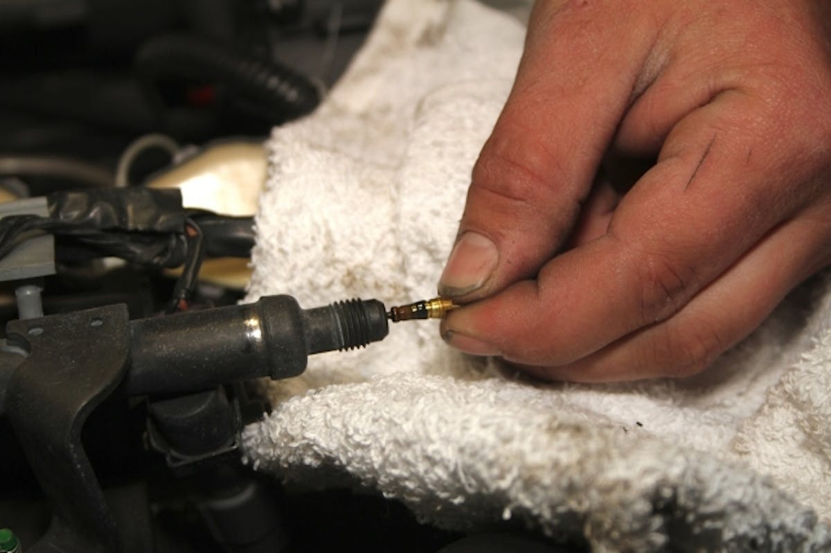 General Motors was nice enough to install a handy fuel supply point for our nitrous system right in the factory fuel rail, though they have to call it a 'test port' because of lawyers and stuff. Converting it to its true purpose just requires removal of the valve core, and attaching the AN fitting that supplies the fuel solenoid.