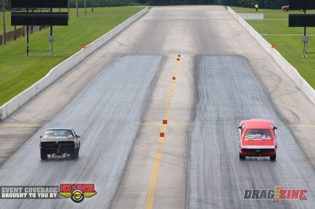 That is indeed Jason Lee's Strange Engineering-backed Street Outlaw Mustang with the wheels HIGH in the air as he neared the half-track mark. Lee's machine had gone skyward at the hit, and after briefly touching down, began to climb once more, eliciting a huge applause from the crowd here at Beech Bend.