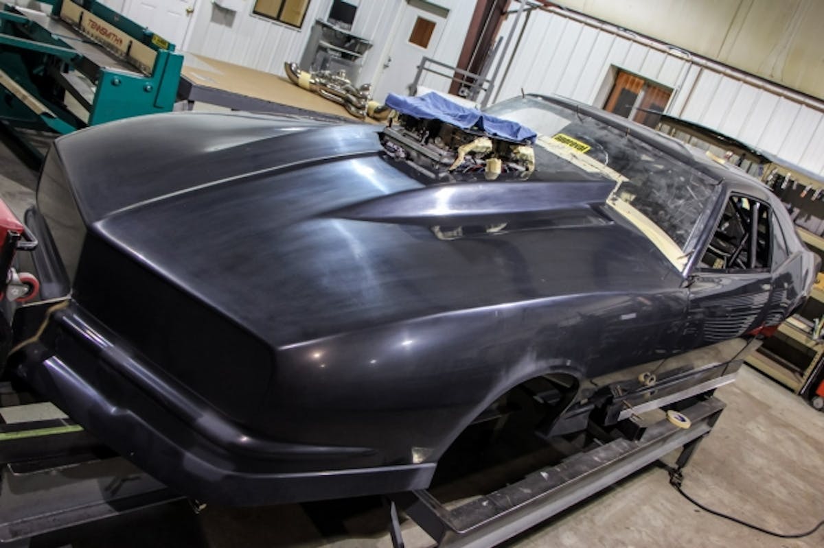 At this point, the customer’s engine is on the premises, so they can install the isolator tray in the scoop.