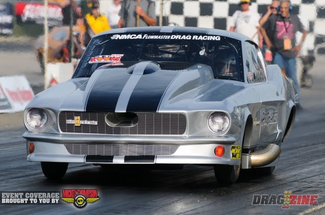 Chuck DeMory Jr. is making his second Pro Street start of the season this weekend with his ProCharger-equipped GT500 fastback Mustang. DeMory has been working on his new combination for over a year since switching from a nitrous combo in Nostalgia Pro Street to Pro Street. According the second-generation racer, the F3 ProCharger and RaceDrive combo are making good power on the top end, but they've had to creep into it down low. The car recently carded a 6.37 during a test session in Michigan. In the opening session today, DeMory drifted out of the groove, and almost saved it, but ended up brushing the wall with the drivers side of the car, leaving some battle scars and a flattened 'bullhorn' pipe.