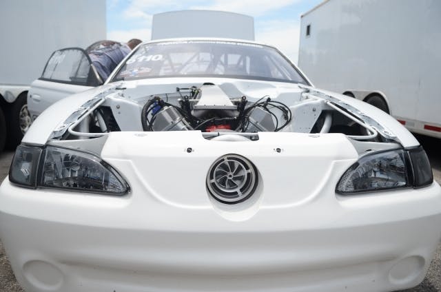 John Kolivas is in the house this weekend, and any time the white Mustang is in the field, things are sure to be interesting. As a many-time NMRA champion, Kolivas has had a number of great moments here at Beech Bend, and he'll look to add to his run here in Street Outlaw with his single-turbo, small block Ford combo.