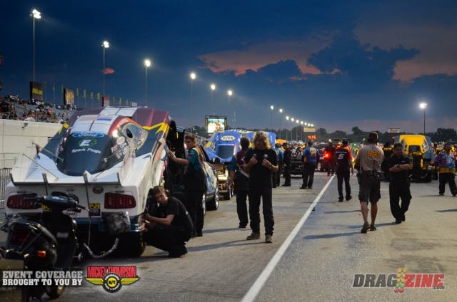 If you were one of those that left the Lucas Oil Raceway during the long rain delay - and there were many of you - than you certainly missed out. NHRA Safety Safari members worked all evening to get the racing surface dry so we could resume Funny Car qualifying. As announcer Alan Reinhart put it as the teams rushed to the lanes, "if you're a Funny Car crew chief, this isn't the time to be bashful." Remarkably lower air temperatures and a big drop in track temperature thanks to the rain meant it was prime time to lay down some numbers.