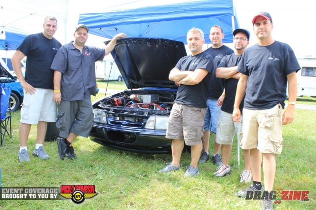 Val Musi runs this F-2 Procharged Mustang in Outlaw Drag Radial. He qualified last night with a 4.93 @ 145 and sits on the bump at number 16 of 22 entries after one session. The car was built by Star Racing and is powered by a 363 small block Ford topped with TFS Hi Port heads and R intake by Ron Sharp and tuned by Job Spetter at Turbo People. Blower drive is from The Supercharger Store. Out back is a 9 inch rear with Strange internals with a powerglide sending the power back. Val has had the car about 4 years with his best pass a 4.74 @ 153 with about 39 PSI of boost. The crew from left to right,  Matty Tutturici, Will Dabrowski, Val Musi, Chris Jurkowitsc, Tommy Zangara, John Buttacaboli and Frank Zangara (not shown).