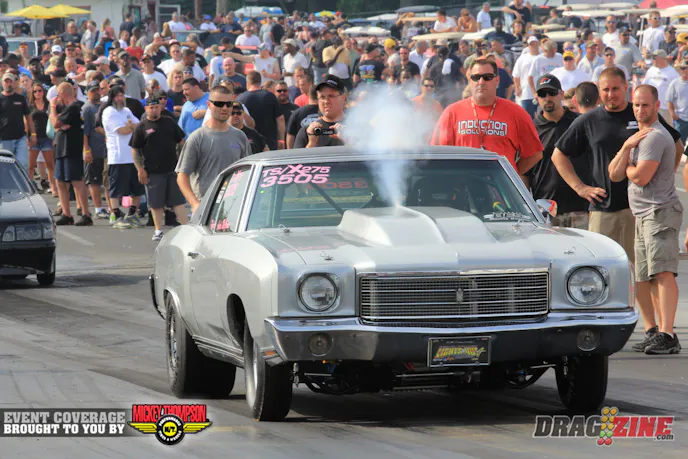 Audry McGrane purges the nitrous as Steve Johnson from Induction Solution looks on. She is currently 34th and not qualified with a 5.41 @ 137 with a soft launch.