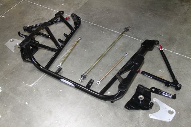 The Racecraft K-member that will serve as the nucleus of our strut and spindle mount wheel/brake installation.