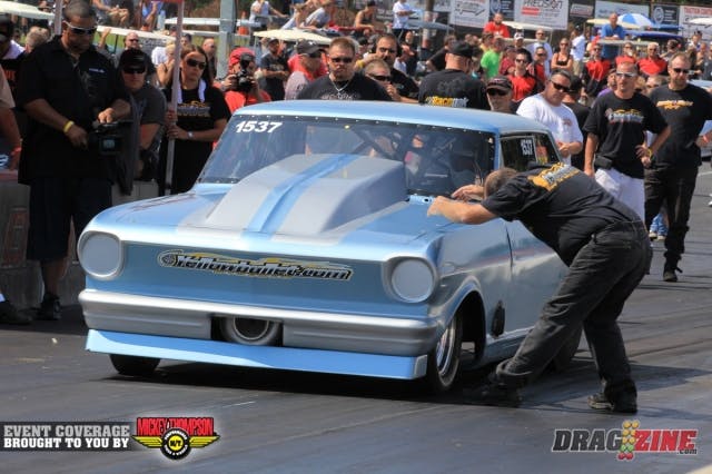 Camp Stanley and his son John are here this weekend tuning on their friend Scott Kline's 63 box Nova. Camp put him in the beams onhis way to a 4.68 @ 155 on a single in OL Big Tire.