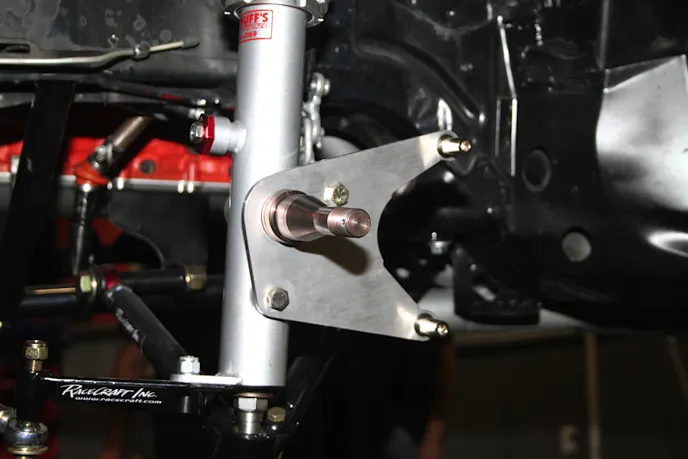 The struts come with the bracket for mounting the brake caliper, which, paired with a set of "hot dog" brackets creates the structural support for the caliper. With the rotor on the wheel, we can go ahead and place the wheel onto the awaiting spindle.