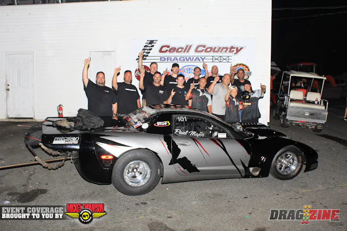 Paul Major and the DMC crew worked hard this weekend qualifying second in Outlaw Drag Radial and setting low ET in the semis against Phil Hines woth a 4.300 @ 188 MPH. While testing with Eric Lefarrier just last Friday the engine dropped a valve. it was dropped off Sunday to J&E Performance for repairs and delivered to the track for the weekend where the crew installed the fresh big Chevy. He met with Dwayne Gutridge in the finals running a 4.369 @ 184 to get around Gutridge's better .025 light and the win.