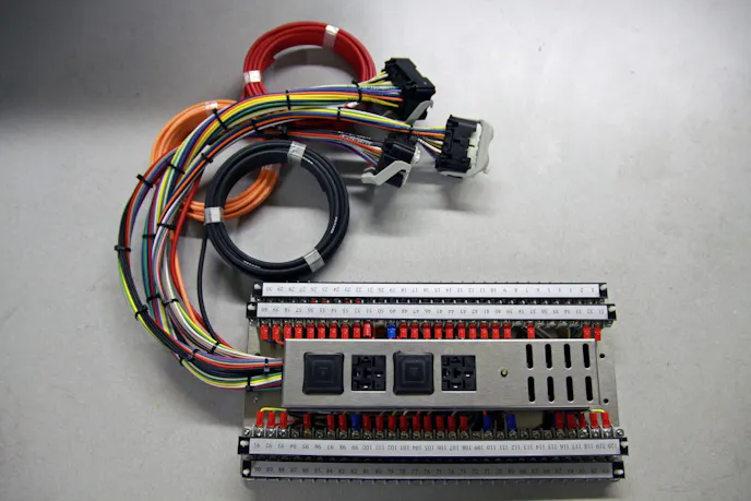 RFW's Three-Valve Mustang harness allows the end-user to install a 3V Mustang engine into any vehicle. There are PCM connections, a MIL circuit, and enough electrical hookups to run everything else in the vehicle. The beautiful of this system is that the computer can be placed anywhere it will fit in the vehicle.