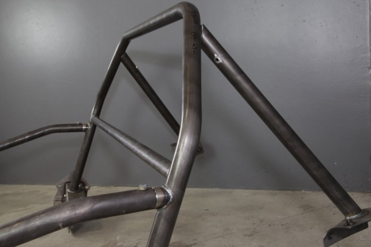 The rear support tubes slide over a spud that is welded to the main hoop of the roll bar.  The rear bars must be initially bolted to the main hoop.