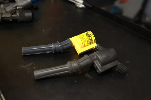 The stocker on the bottom versus our new ACCEL Super Coil on top. As you can see, external dimensions are virtually identical, but inside the Super Coils have more spark energy thanks to more efficient internals.