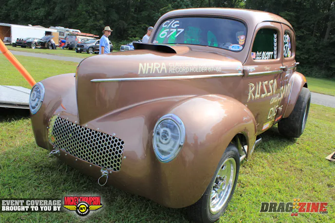  John Olcott owns this 41 Willys original NHRA record setting car campaigned by Russo and Santo. John II and his father found the car back in the 80's and restored the car to look as it did in 1967 where it won Indy and have been racing it for about 12 years in various nostalgia races.  This is their first time here with the trip being promted by John III. it now has a big block Chevy power plant and runs mid 10's