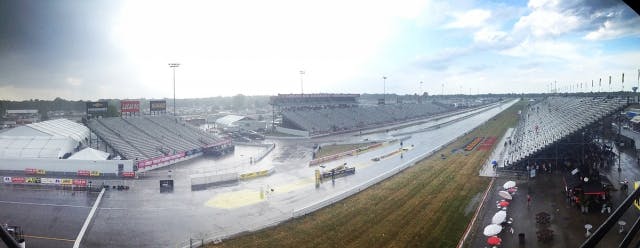We got through the second session of Top Fuel and a pair of Funny Cars before the dark clouds that had been descending upon Lucas Oil Raceway began to spit enough to bring a stoppage to the action. After touching up the track, the next pair of cars were rolling to the ready-line when the skies unloaded. High winds, blinding rain, and hail sent spectators and race teams scattering for cover. Needless to say, we'll be down for a while.