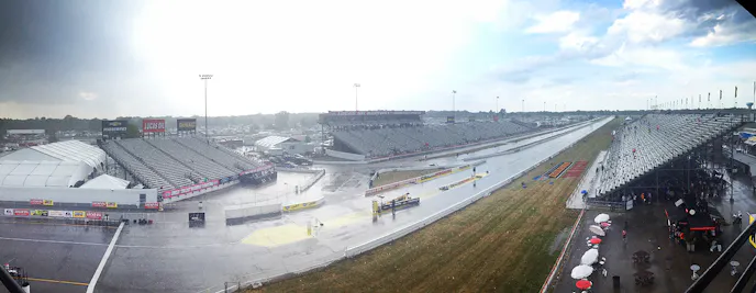 We got through the second session of Top Fuel and a pair of Funny Cars before the dark clouds that had been descending upon Lucas Oil Raceway began to spit enough to bring a stoppage to the action. After touching up the track, the next pair of cars were rolling to the ready-line when the skies unloaded. High winds, blinding rain, and hail sent spectators and race teams scattering for cover. Needless to say, we'll be down for a while.