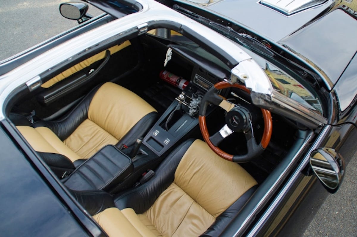 T-top removed, we can see the two-tone leather seats, wood-accented wheel, and other cool touches courtesy of SS Trimming. Photo by William Billy Cocks.