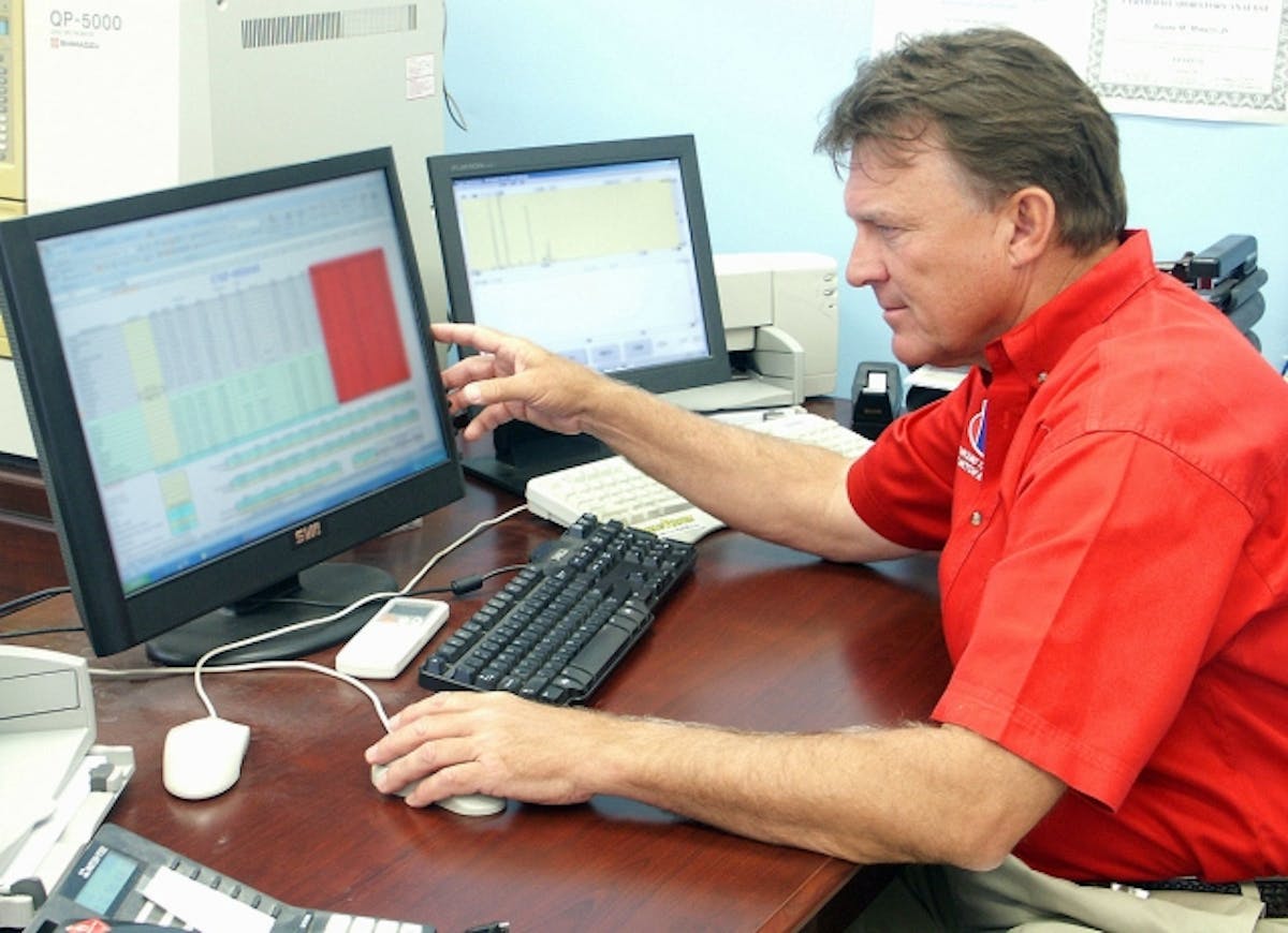 VP Racing Fuels' President Steve Burns with one of the computer programs the company uses to design their lineup of racing fuels.