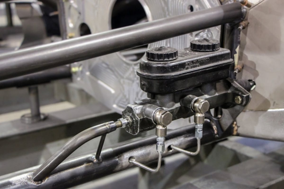 At this point in construction the team pre-fits all of the stainless brake and fire bottle lines. You can see in this image the conduits that are installed in the frame rails to run the lines through. These conduits are small 1” long pieces of 4130 tubing that are fit in the direction the tubing is run and then welded into place. These will help keep the frame rail from breaking if there is an impact in this area.