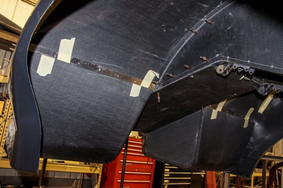 Once the tubs are secured into place the filler between the tub and rear bumper is installed. Since the TMRC team builds all of the carbon in-house at Velocity Composites, they have molds for the complete interior of this body style. This makes it an easy project for the guys in the shop and those using TMRC kits to knock out.