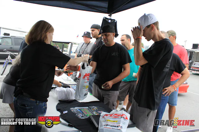 T Shirts, get your T Shirts here. People were lining up early to get event T's this morning. Get'em while they last, come Sunday there will be few if any left.