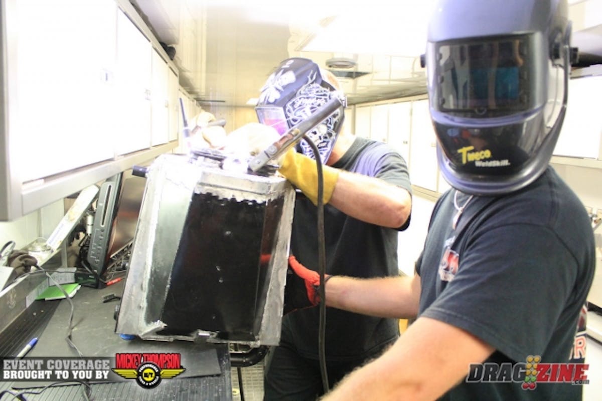 The inter-cooler burst just before the stripe in the Blue Bu. Mark Micke is seen here at the welder with car owner Jason Carter assisting.